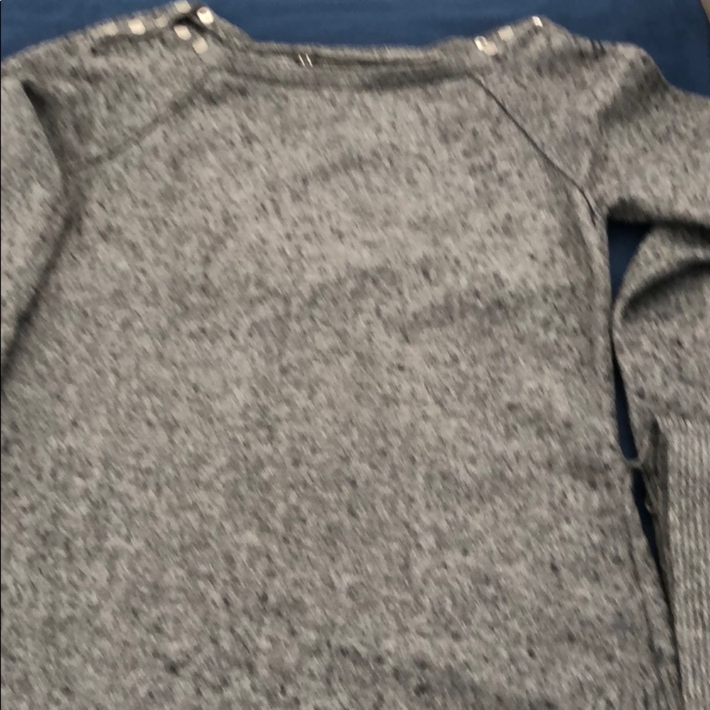Amani Exchange Sweater silver buttons at the neck.